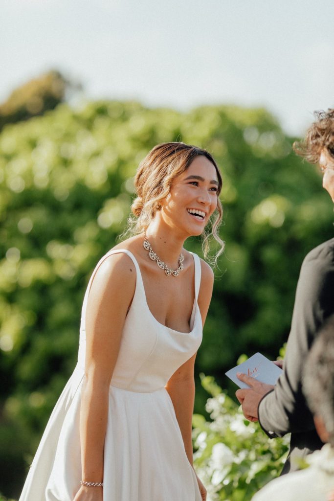 Rebecca laughing during Kyler's vows