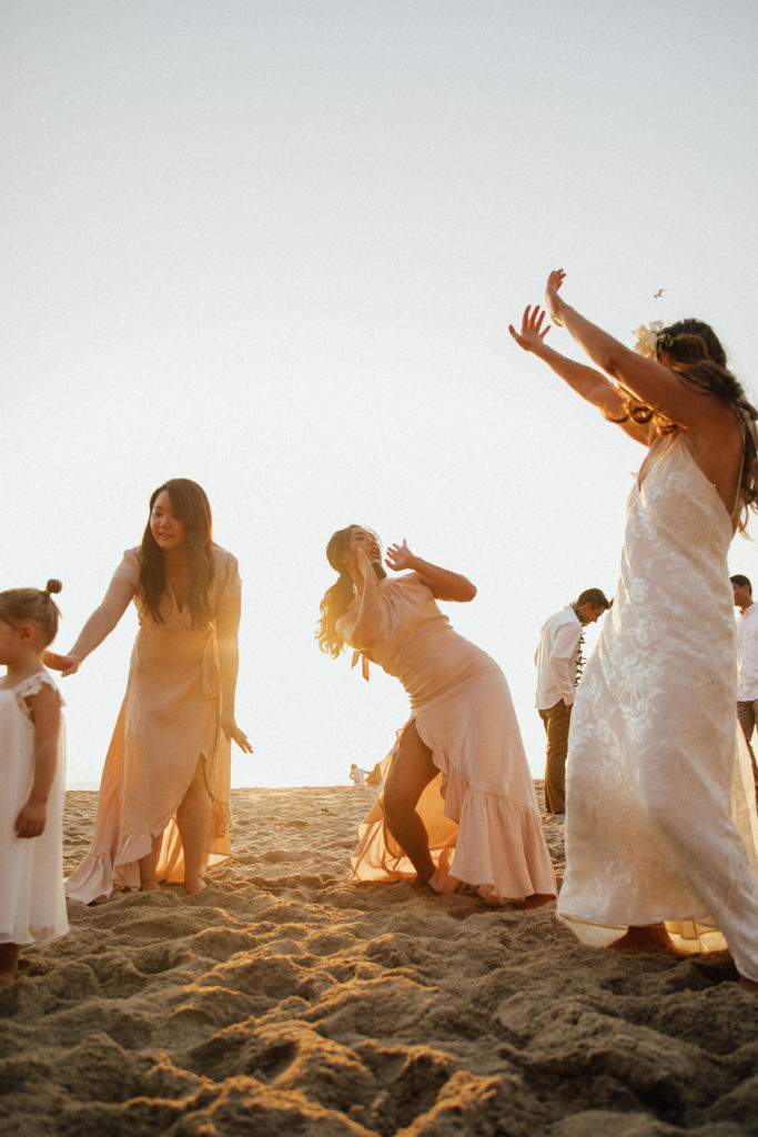 Rachel and her bridesmaids having fun on the beach
