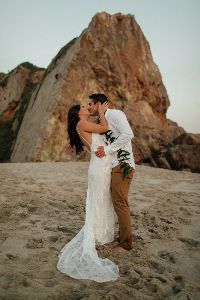 Rachel + Mike kissing on the beach